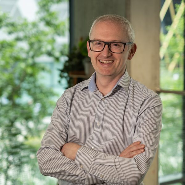 Professional photograph of Richard Strike smiling.