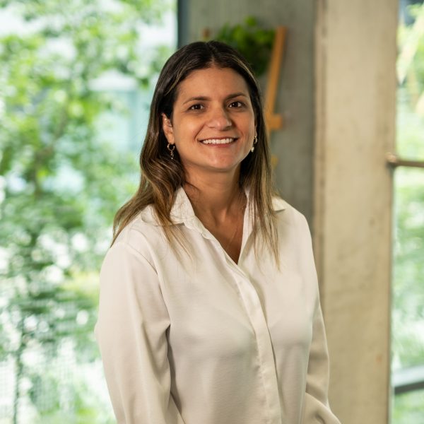 Professional photograph of Carolina Gandara smiling.